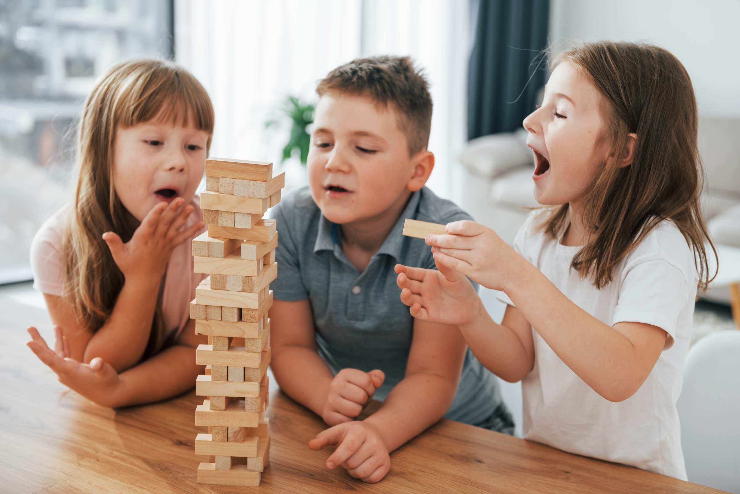 2 focused-jumbling-tower-game-kids-having-fun-domestic-room-daytime-together.jpg 2 focused-jumbling-tower-game-kids-having-fun-domestic-room-daytime-together.jpg