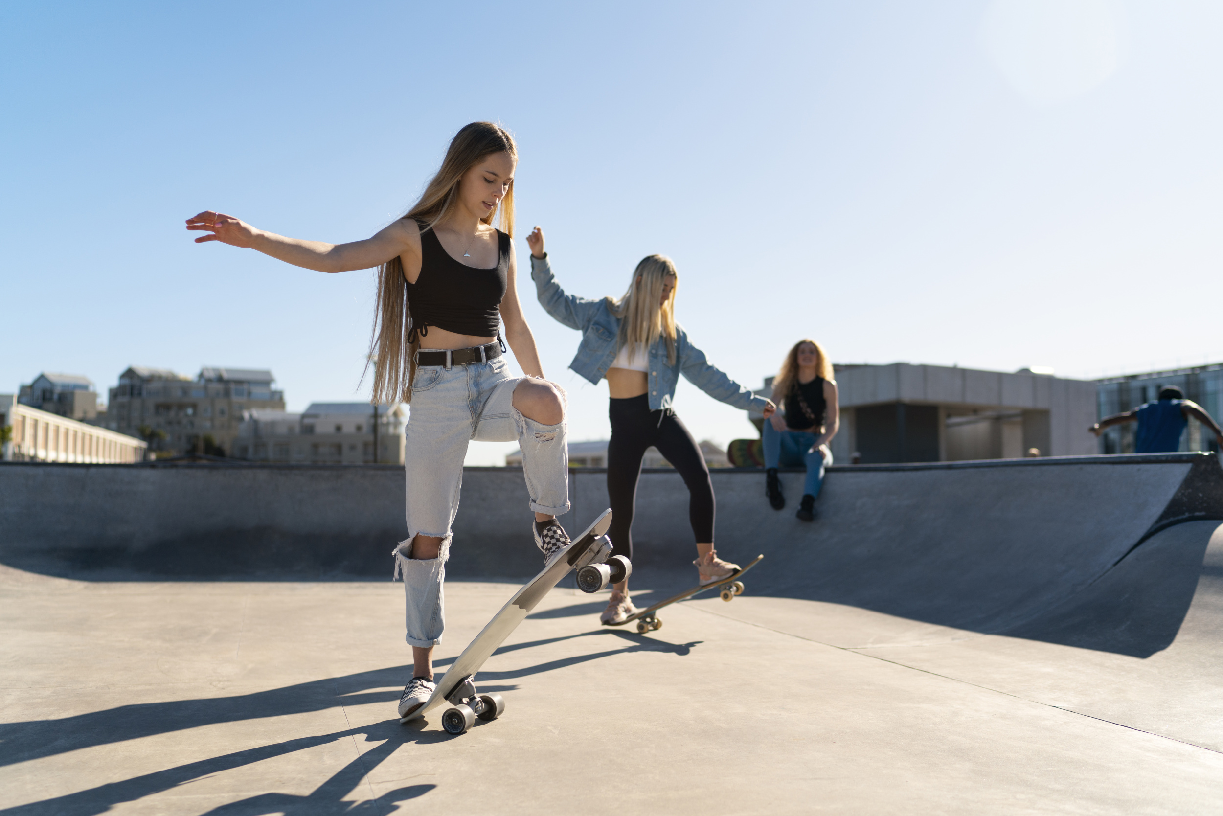 02 full-shot-girls-doing-tricks-skateboards.jpg