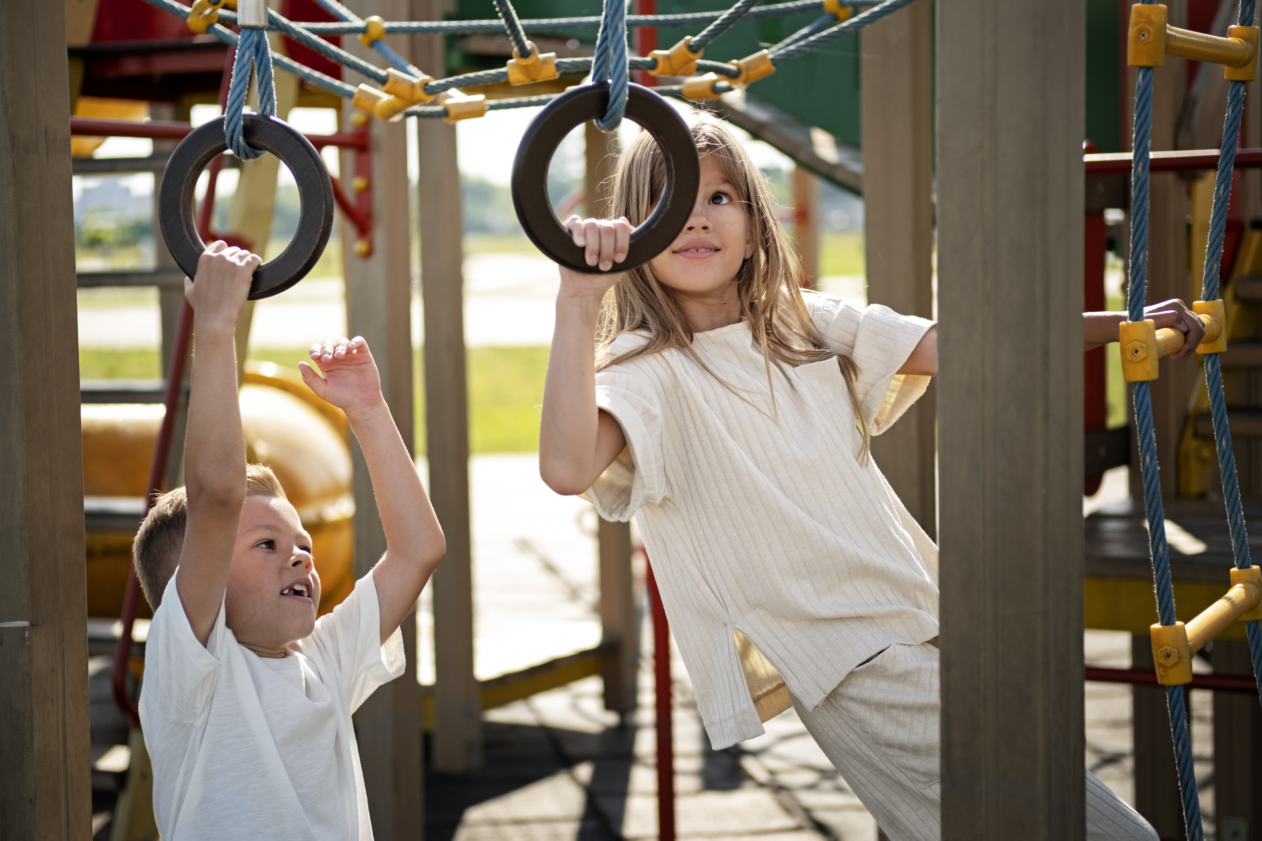 3 brother-sister-having-fun-outdoors-playground.jpg 3 brother-sister-having-fun-outdoors-playground.jpg